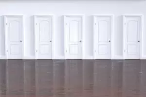 5 white doors representing choices