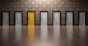 six white doors one yellow door representing best choice